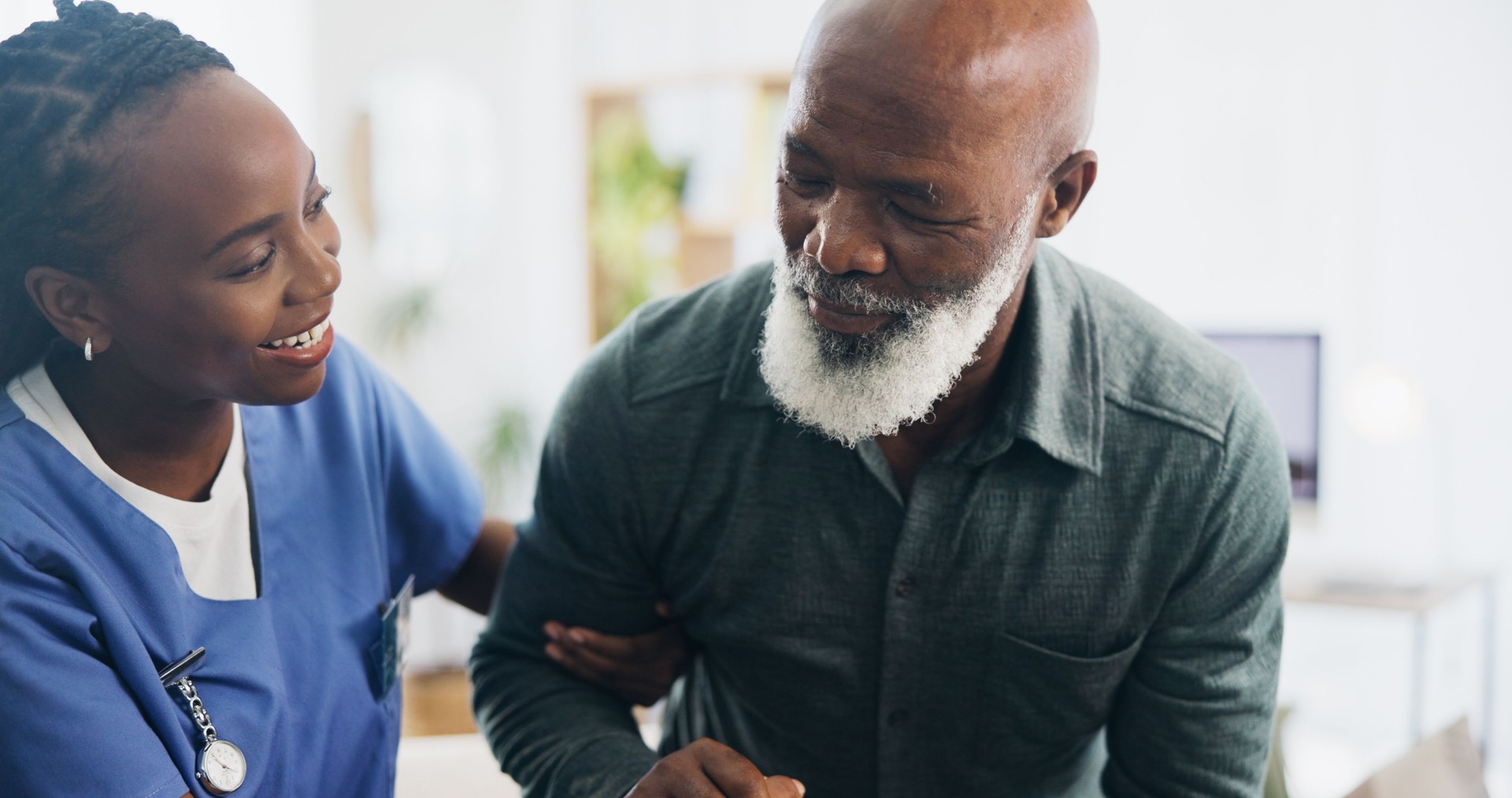 Nurse, elderly man and walking in home with balance, care and support for recovery from injury in retirement. Black people, helping hand and senior person with disability, caregiver or rehabilitation